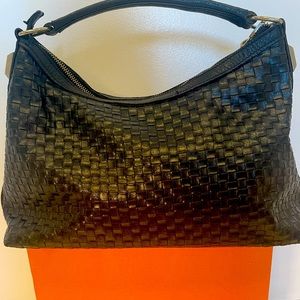 Beautiful Prune handbag in good condition. 14 inches long.